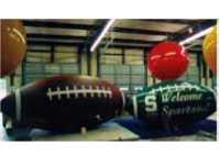 Football balloons - giant football shape helium advertising inflatables made in the USA.